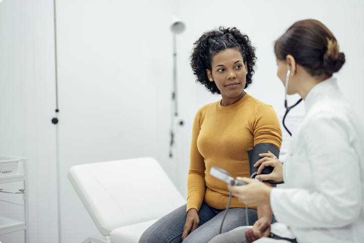 A donor sitting with a doctor